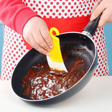 Il silicone pulendo la spatola di raschietto spazzola la spazzola di pulizia di pentola di cucina