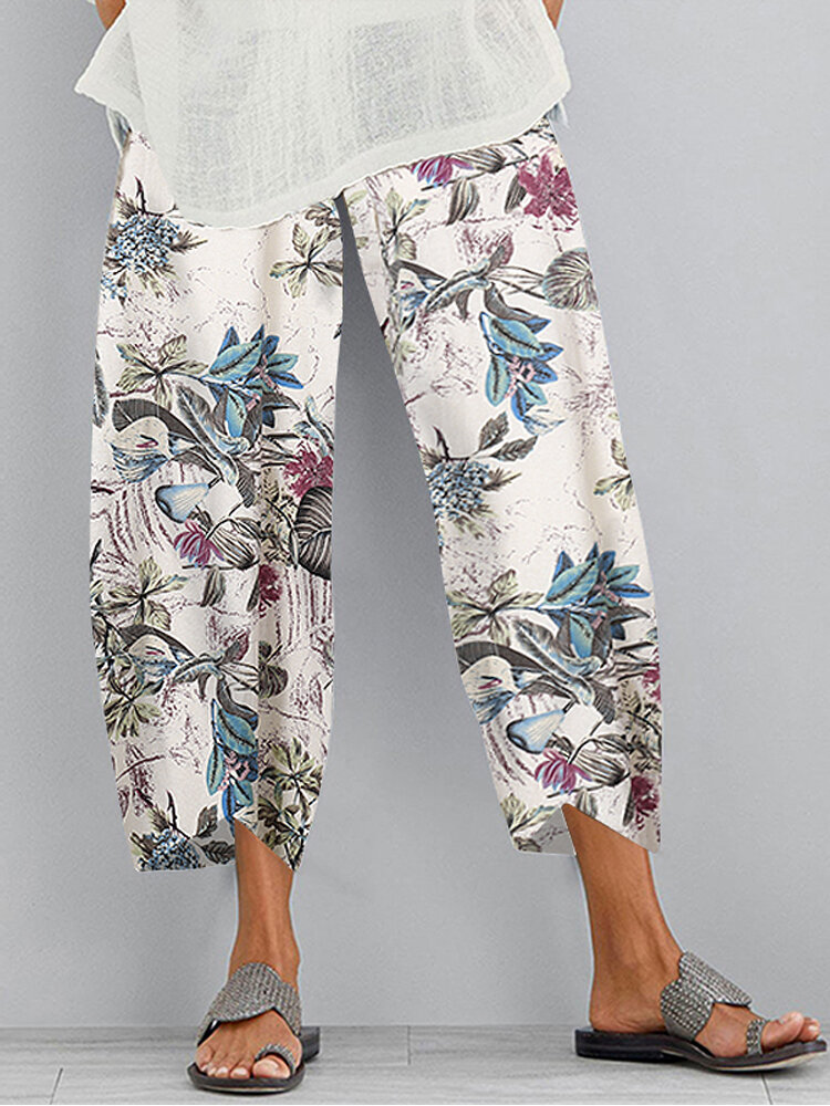 Retro bloemenprint elastische taille onregelmatige zoom zak casual broek voor vrouwen